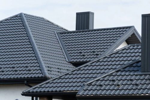 depositphotos 648744376-stock-photo-new-black-metal-roof-house